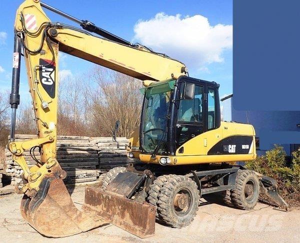 CAT M 315 D Pelle sur pneus