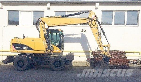 CAT M 315 D Pelle sur pneus