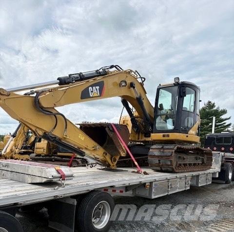 CAT 313 D Pelle sur pneus