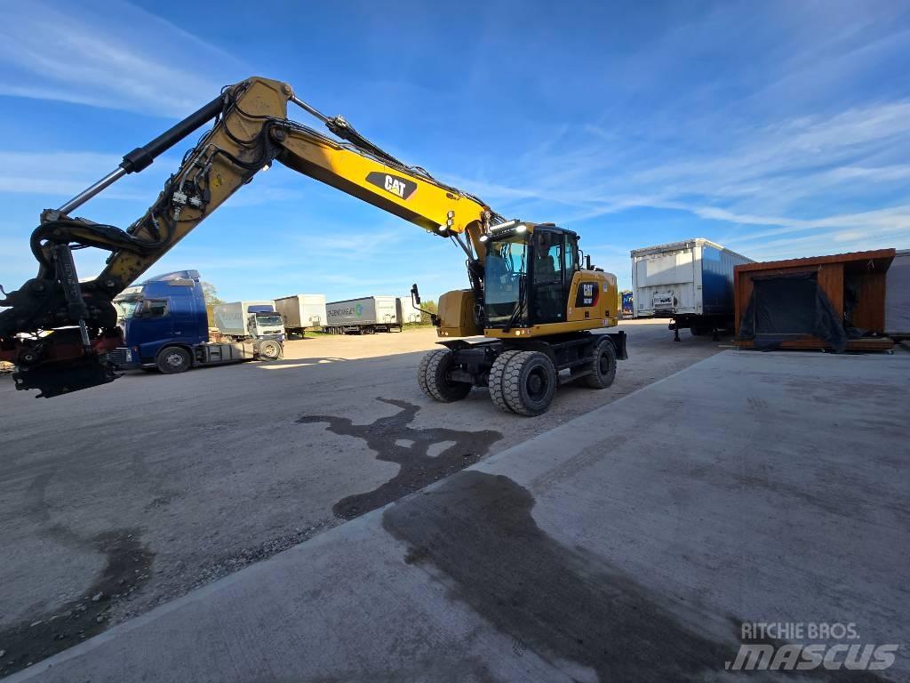 CAT 318 Pelle sur pneus