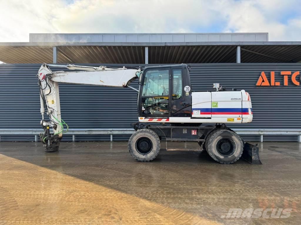 CAT M315D Pelle sur pneus