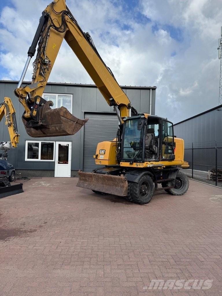 CAT 318 Pelle sur pneus