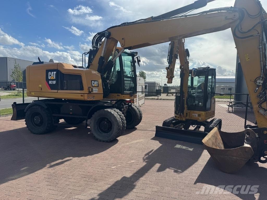 CAT 318 Pelle sur pneus