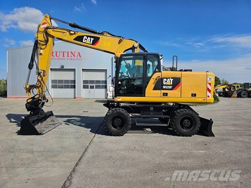 CAT M320F Pelle sur pneus