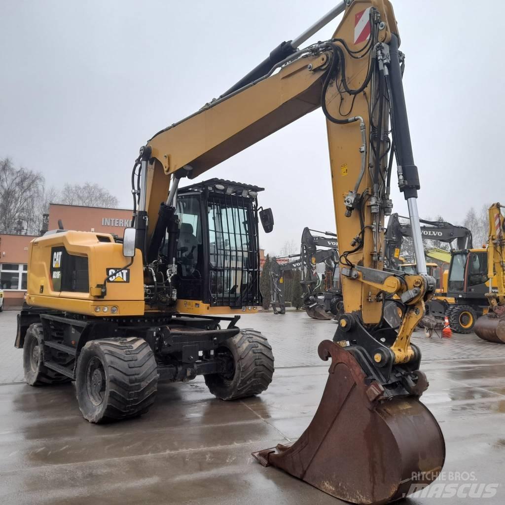 CAT M 318 F Pelle sur pneus