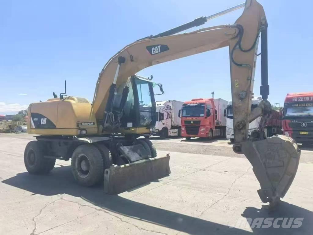 CAT M315D2 Pelle sur pneus