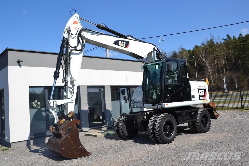 CAT M 313 D Pelle sur pneus