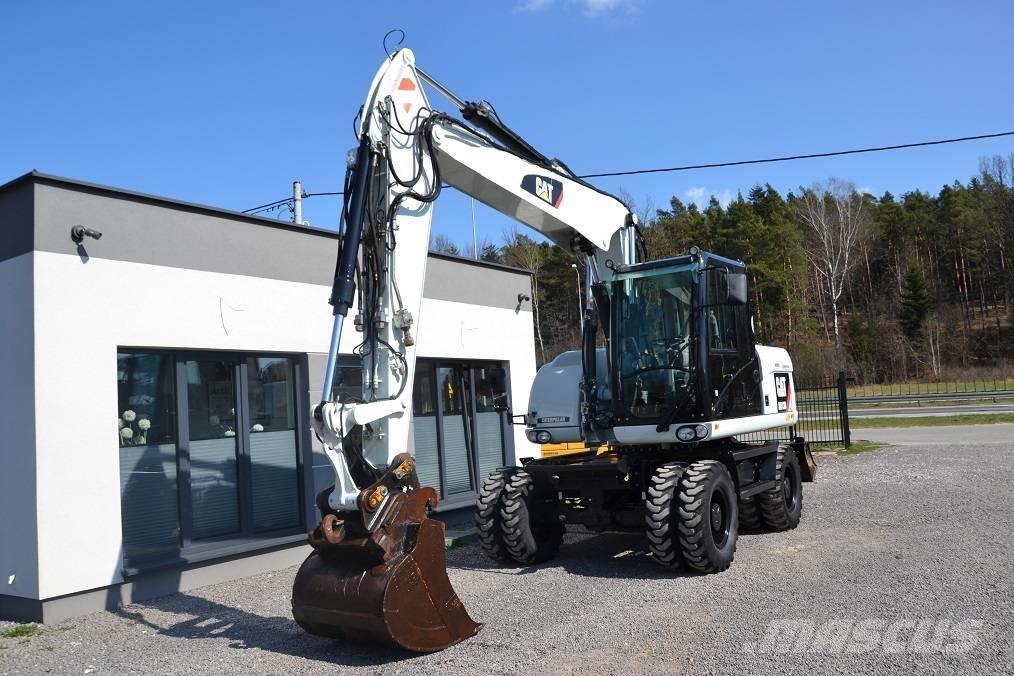 CAT M 313 D Pelle sur pneus
