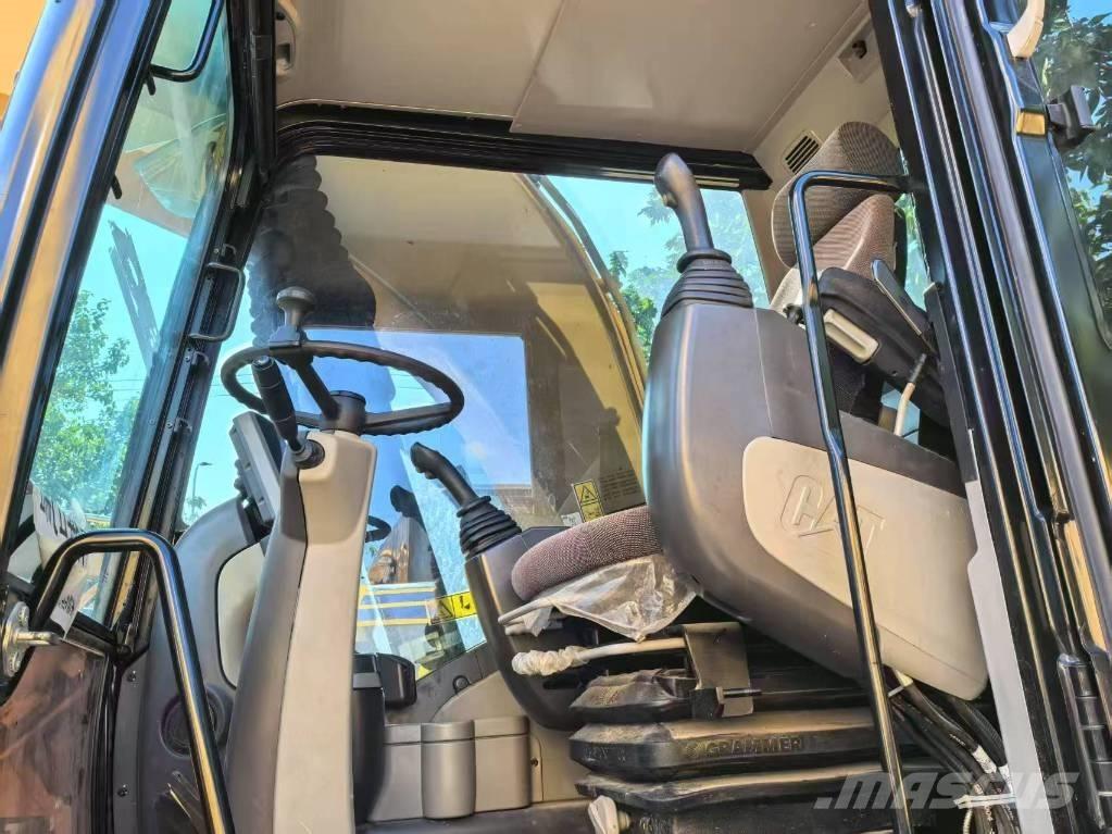 CAT M 315 D Pelle sur pneus