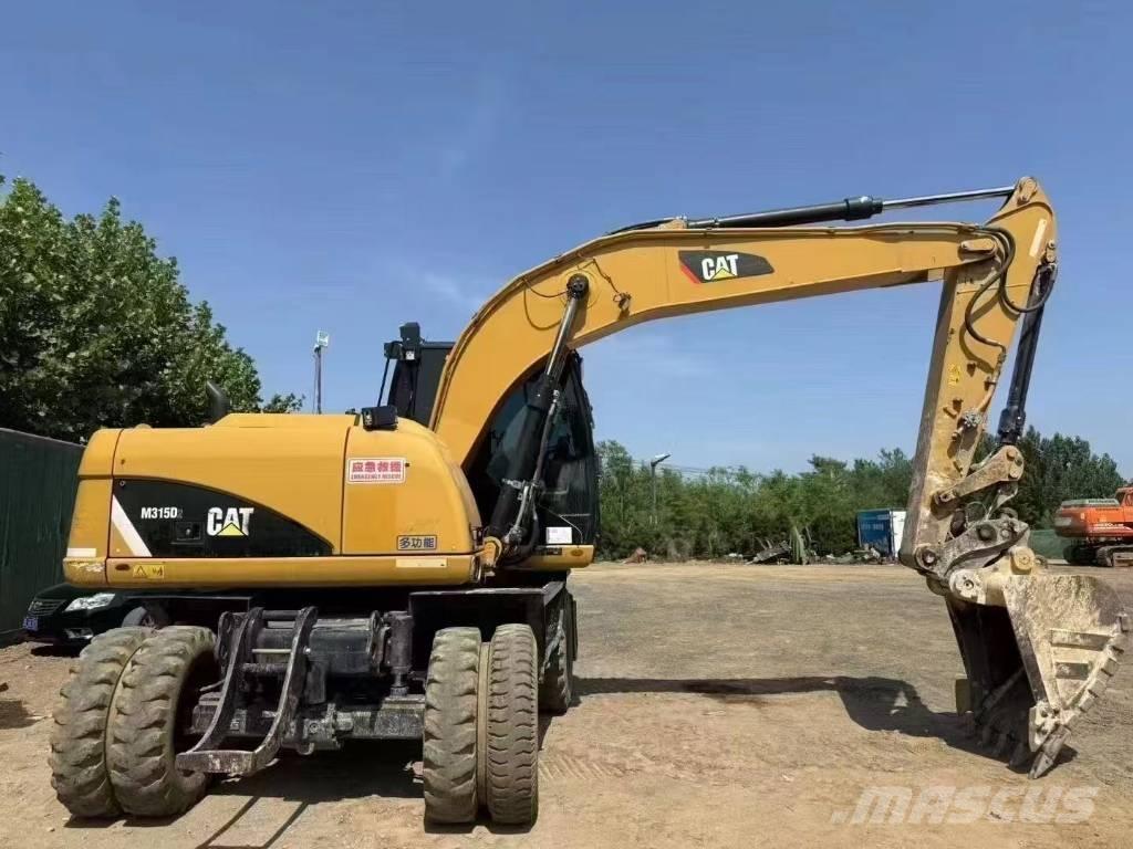 CAT M 315 D Pelle sur pneus