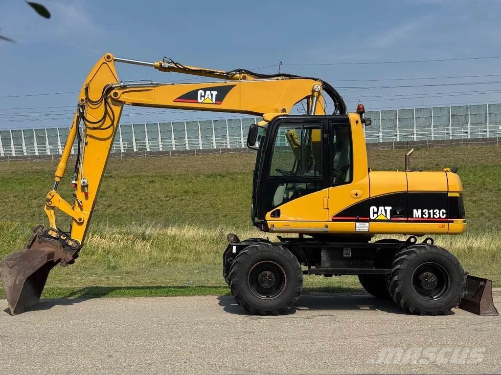 CAT M313C Pelle sur pneus