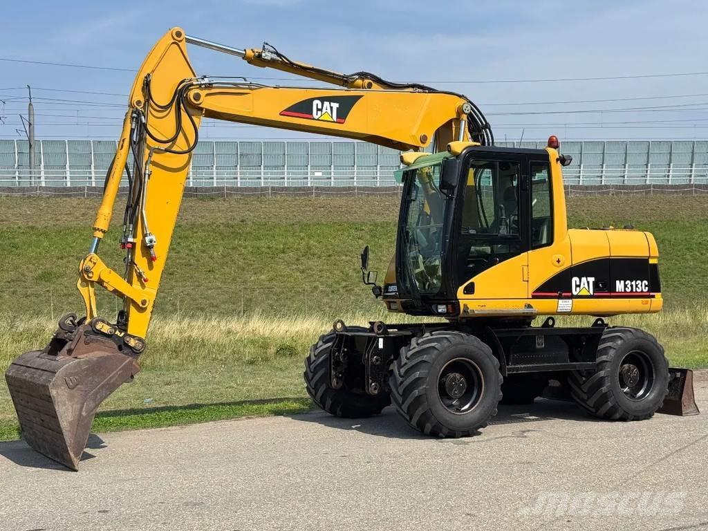 CAT M313C Pelle sur pneus