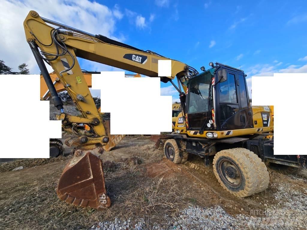 CAT M 315 D Pelle sur pneus