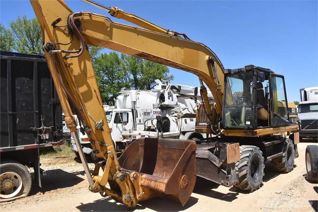 CAT M318 Pelle sur pneus