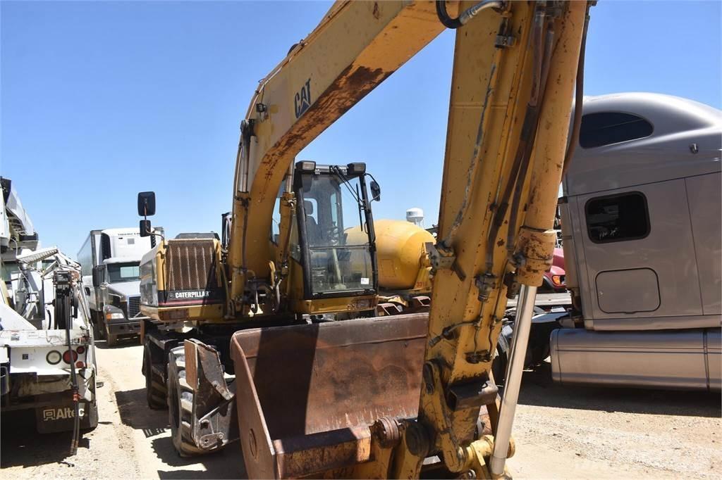 CAT M318 Pelle sur pneus