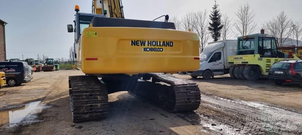 New Holland E 385 Pelle sur chenilles