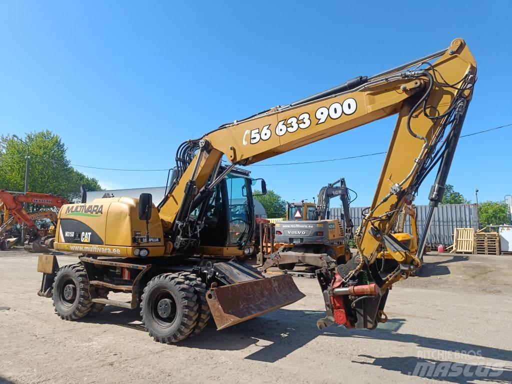 CAT M 315 D Pelle sur pneus
