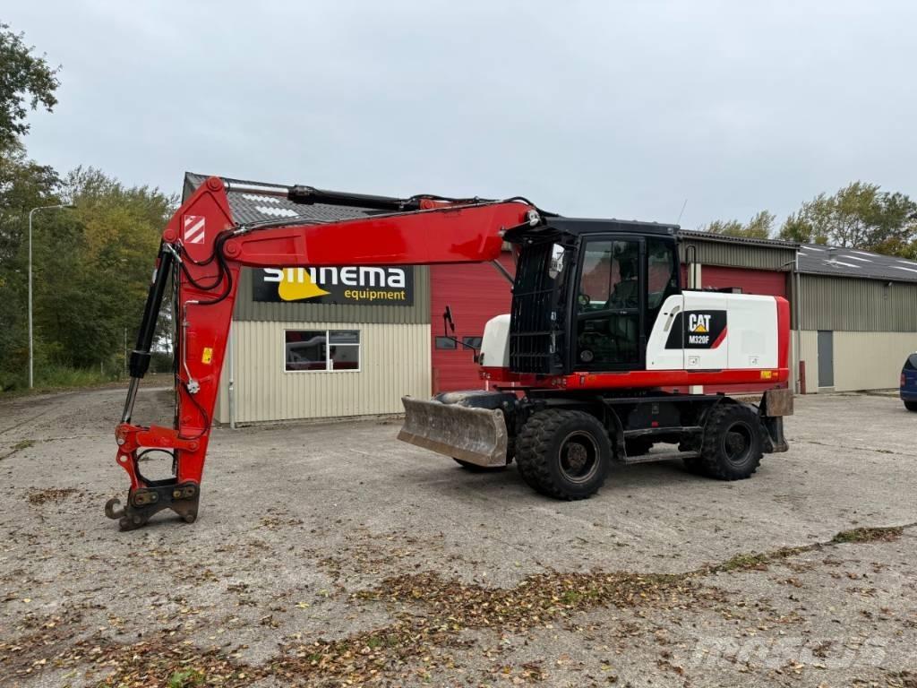 CAT M320F Pelle sur pneus