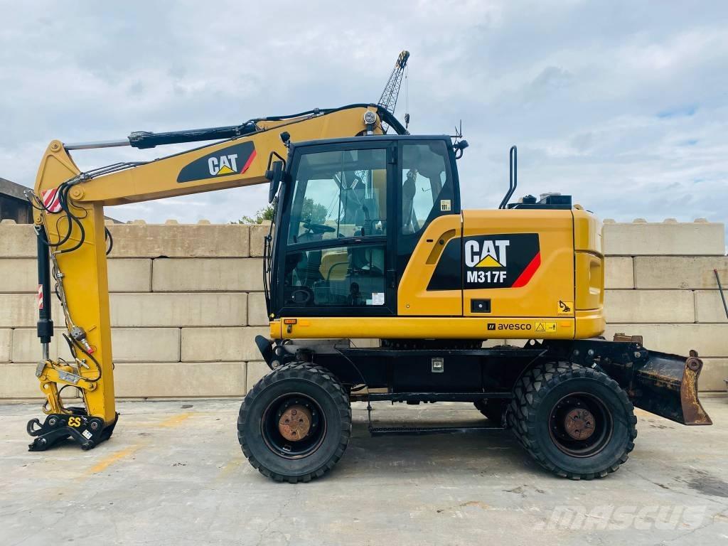 CAT m317f Pelle sur pneus
