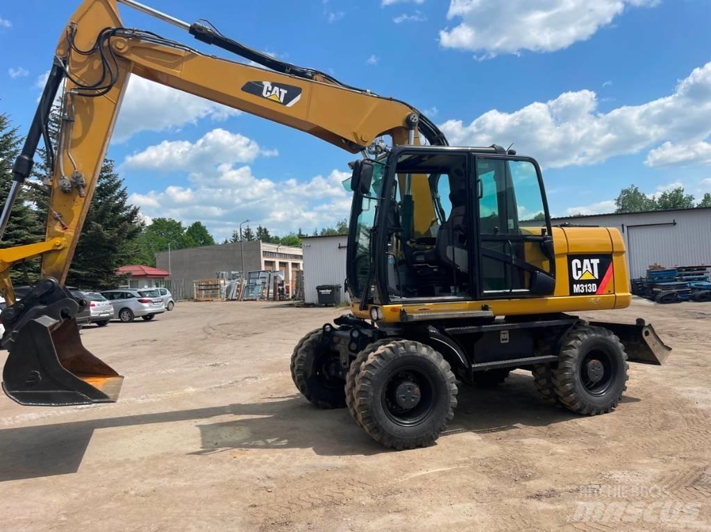 CAT M 313 D Pelle sur pneus