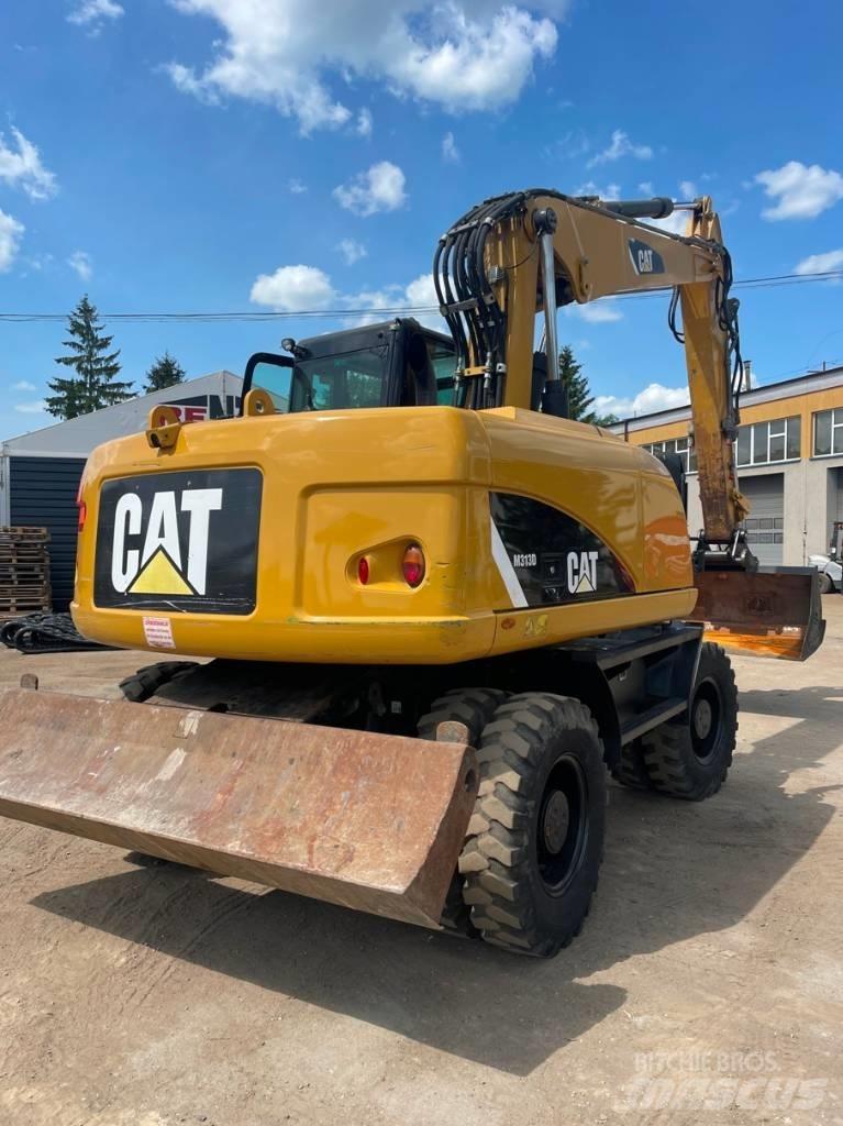 CAT M 313 D Pelle sur pneus
