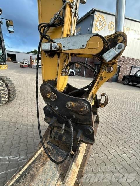 CAT M 318 F Pelle sur pneus