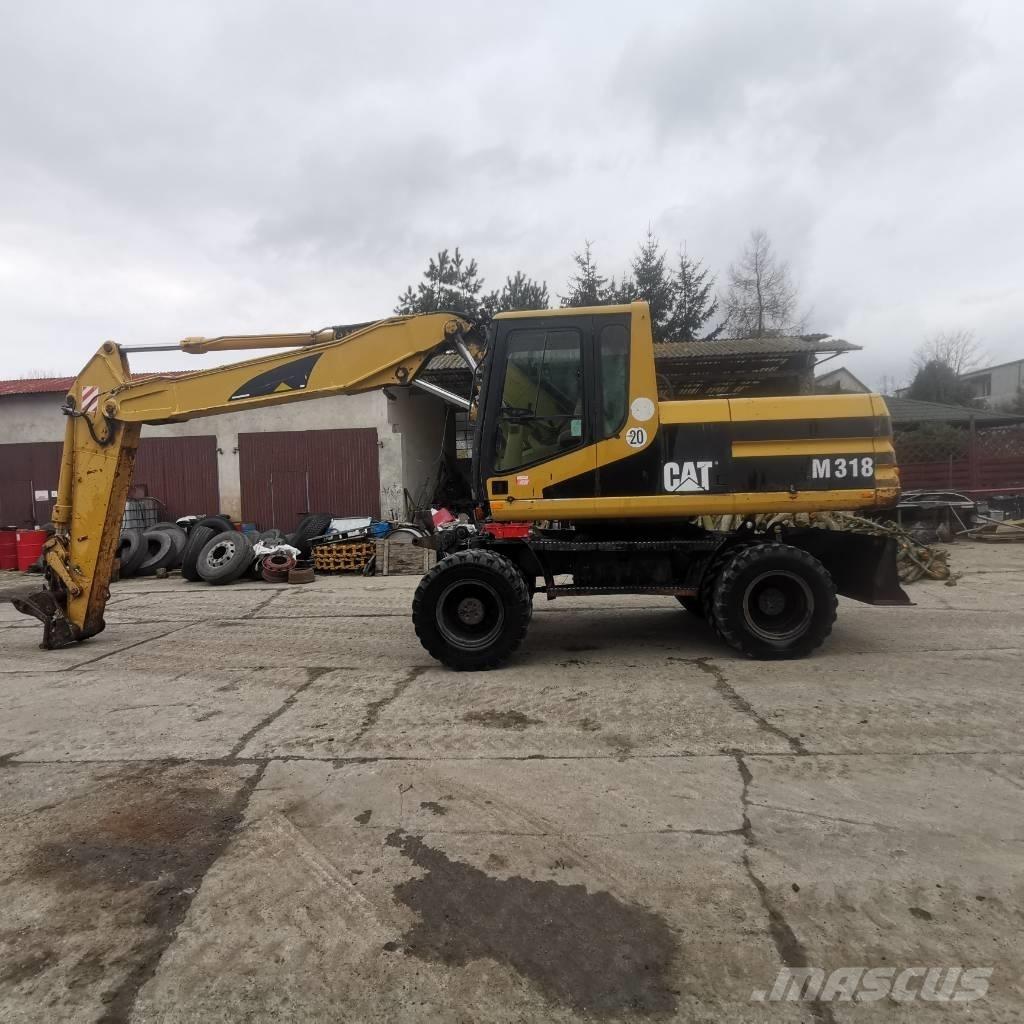 CAT M 318 B Pelle sur pneus