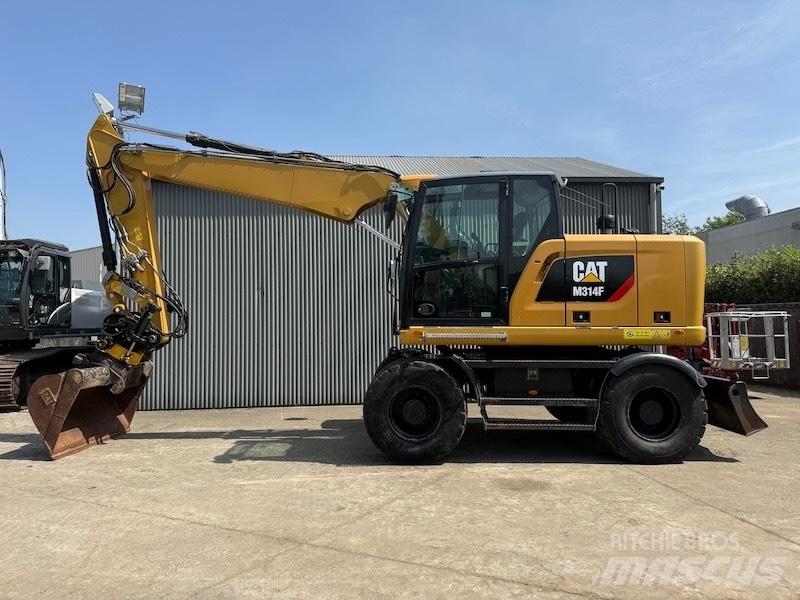 CAT M314F Pelle sur pneus