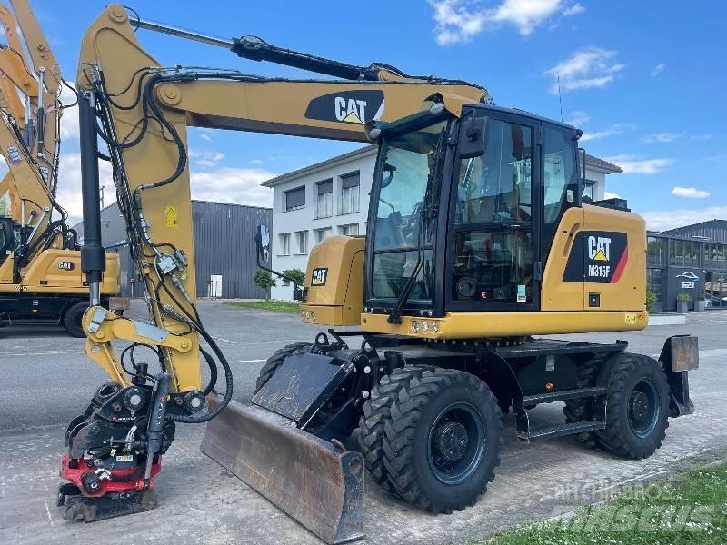 CAT M 315 F Pelle sur pneus