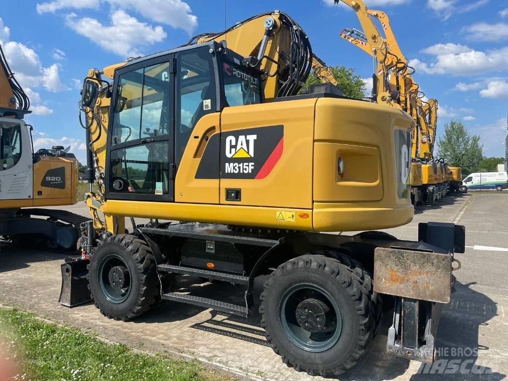 CAT M 315 F Pelle sur pneus