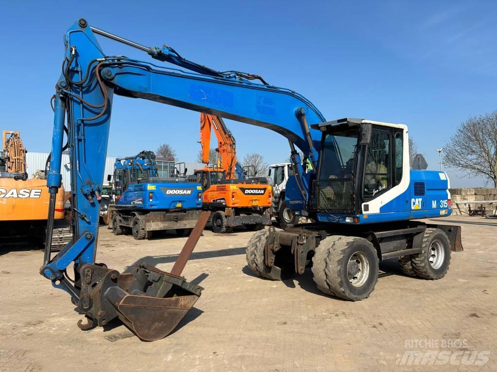 CAT M 315 Pelle sur pneus