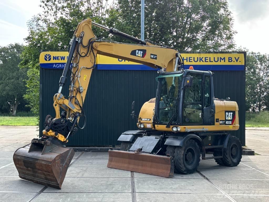 CAT M 313 D Pelle sur pneus