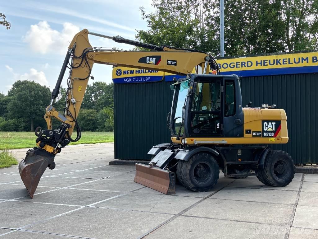 CAT M 313 D Pelle sur pneus