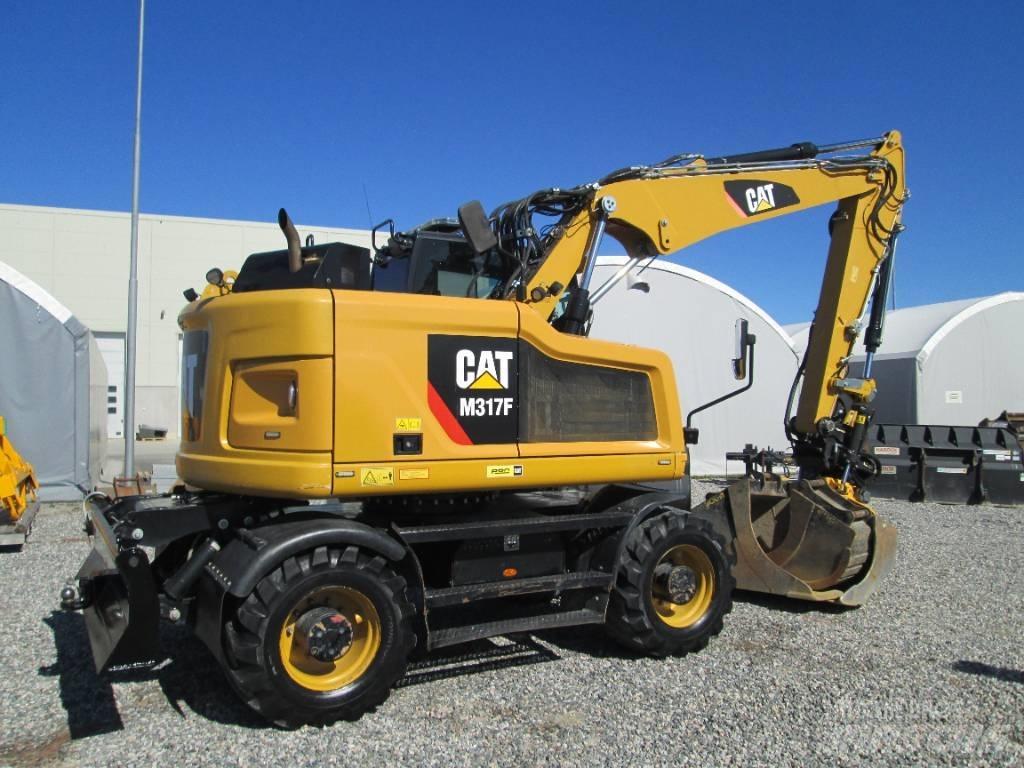 CAT M 317F Pelle sur pneus
