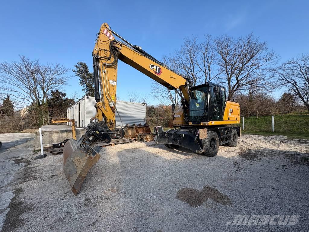 CAT M 318 Pelle sur pneus