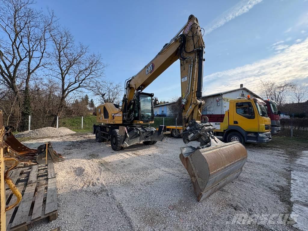 CAT M 318 Pelle sur pneus