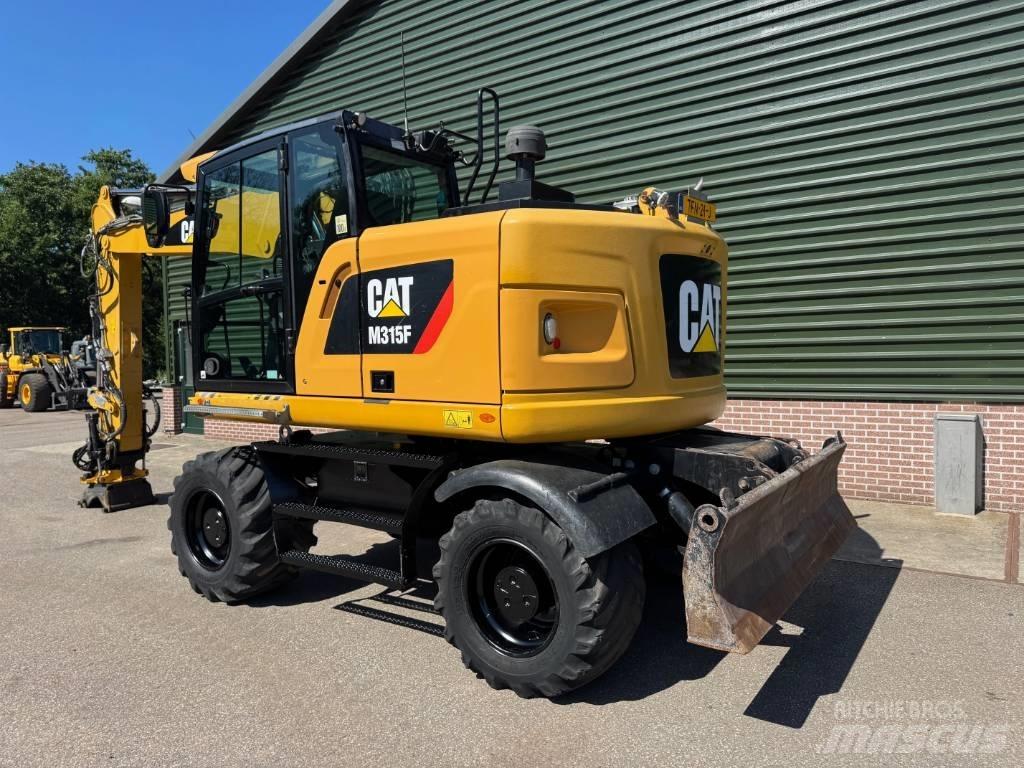 CAT M 315 F Pelle sur pneus