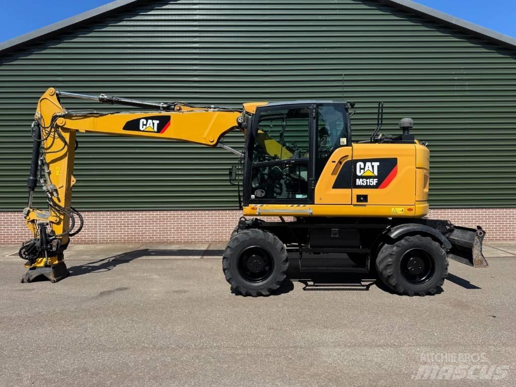 CAT M 315 F Pelle sur pneus