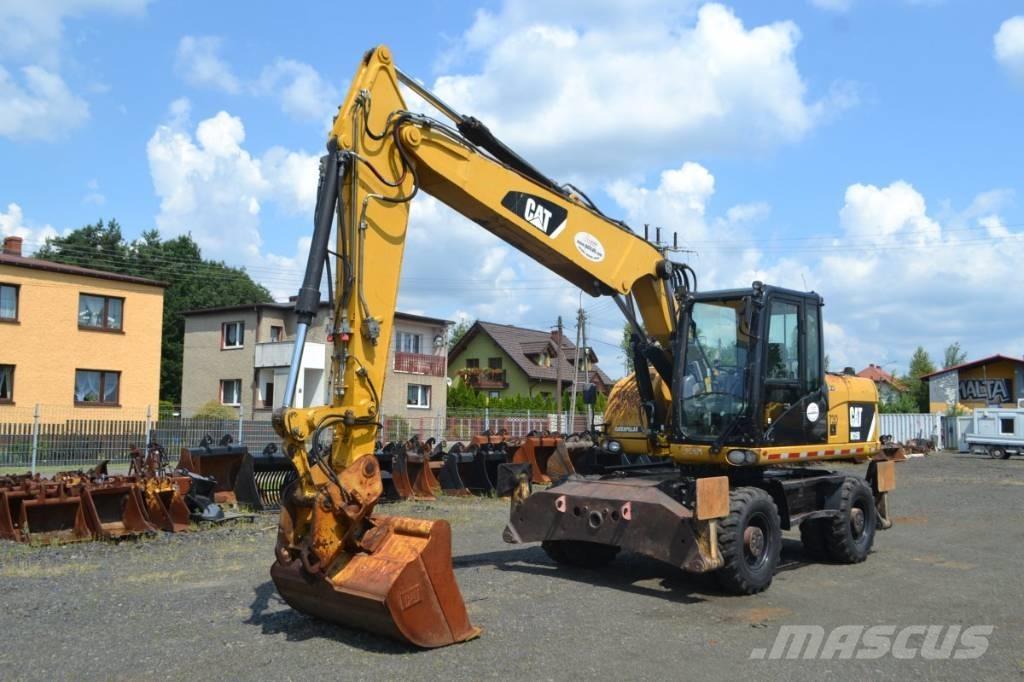 CAT M 315 D Pelle sur pneus