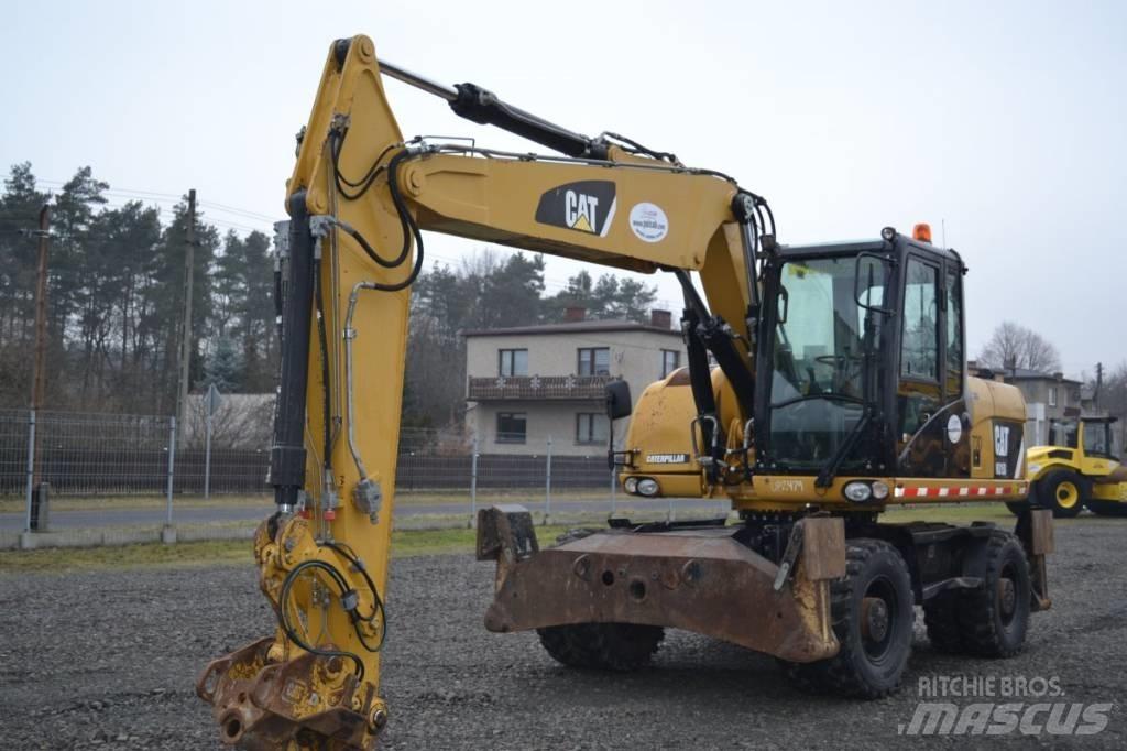 CAT M 315 D Pelle sur pneus