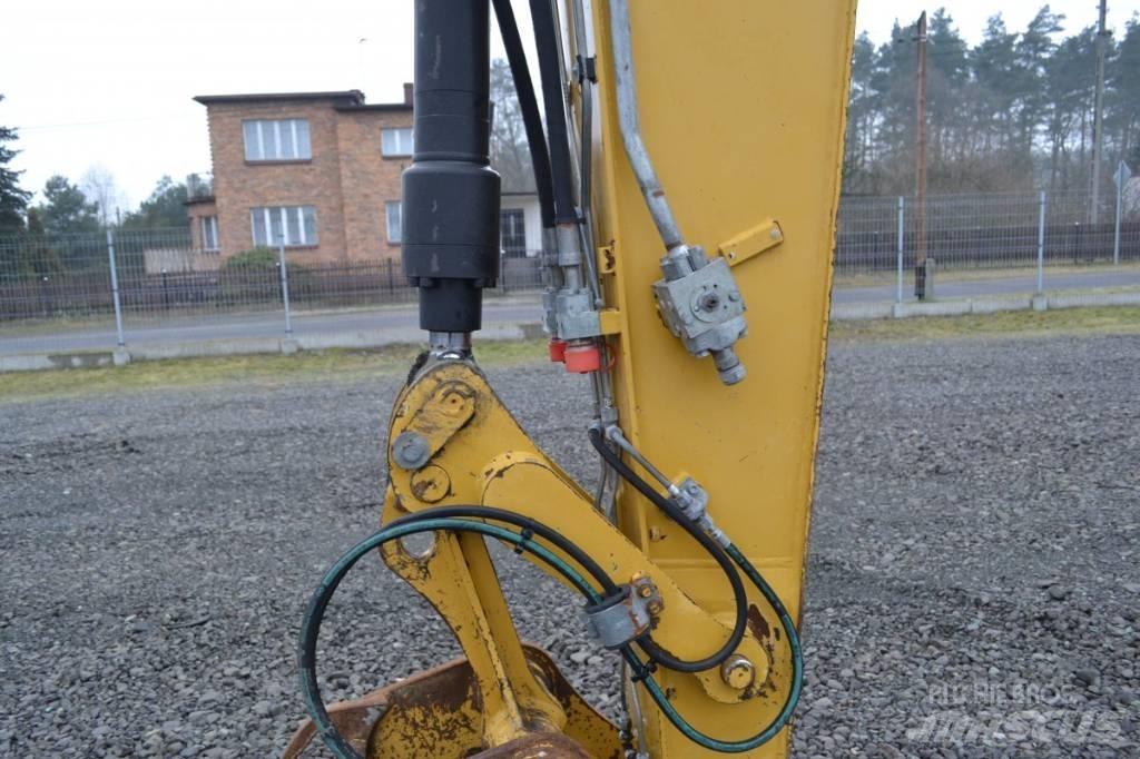 CAT M 315 D Pelle sur pneus