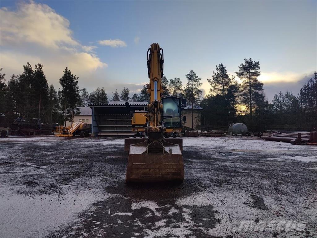 CAT M315 Pelle sur pneus