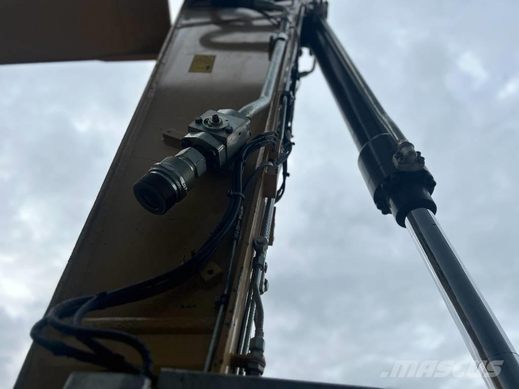 CAT M318F Pelle sur pneus