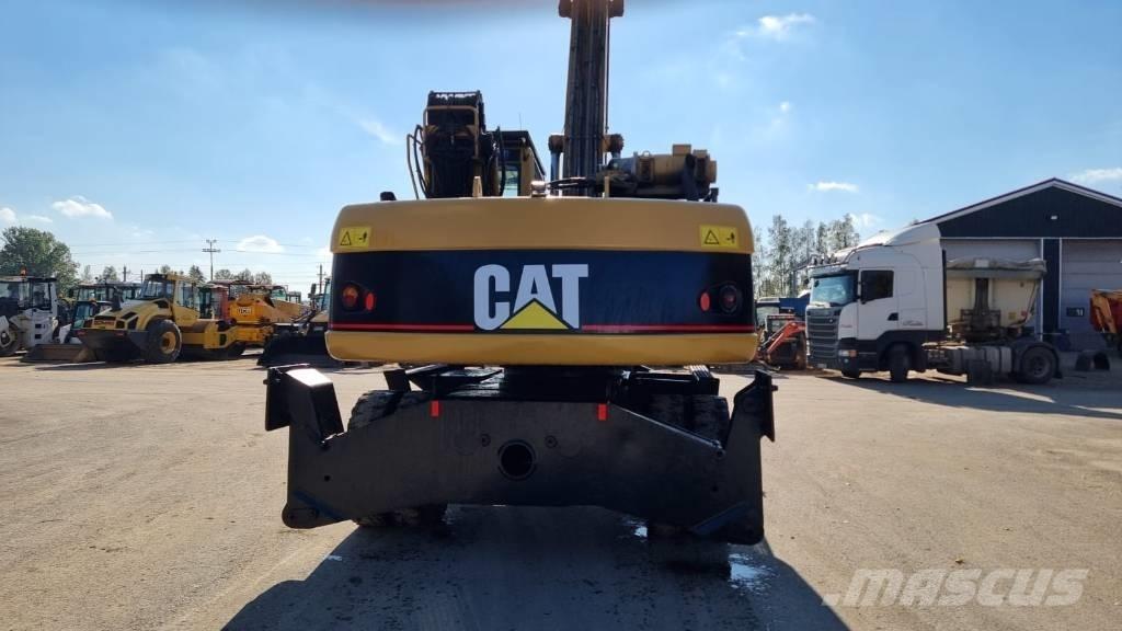 CAT M 322 C MH Pelle à déchets
