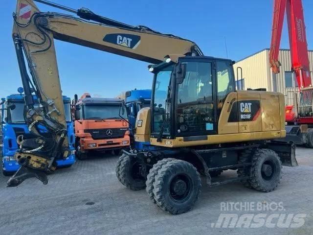 CAT M 318 F Pelle sur pneus