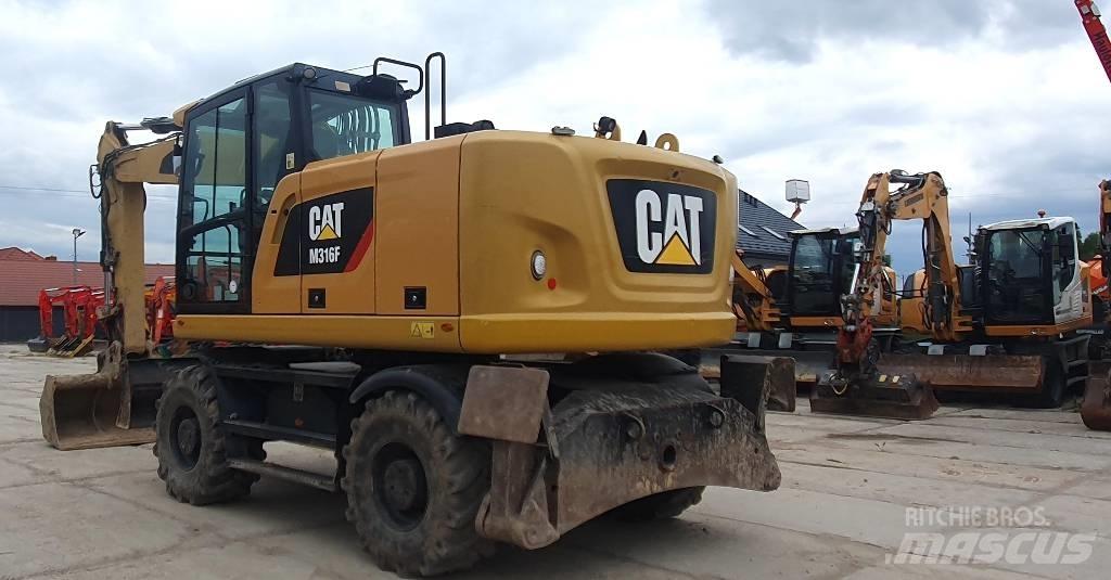 CAT M316F Pelle sur pneus