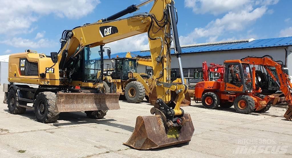 CAT M316F Pelle sur pneus