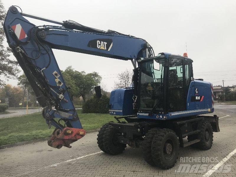 CAT M318F Pelle sur pneus