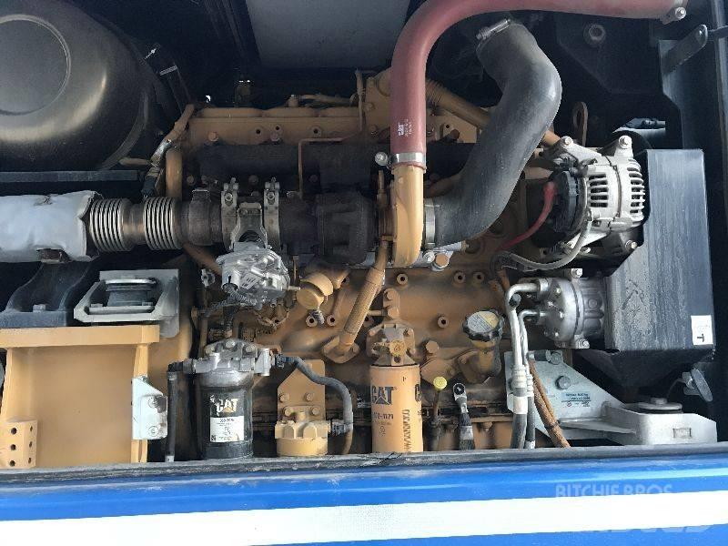 CAT M318F Pelle sur pneus