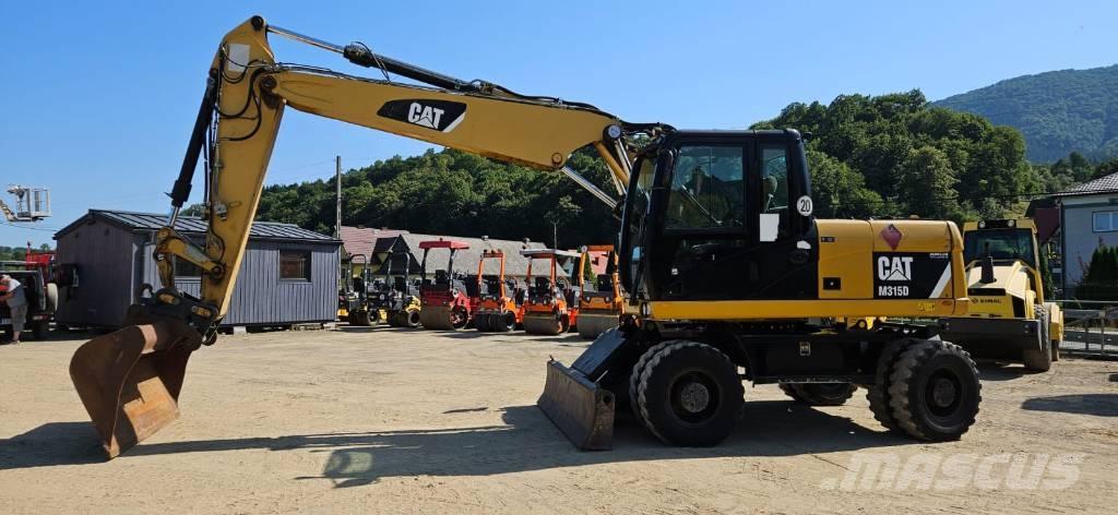 CAT M 315 D Pelle sur pneus
